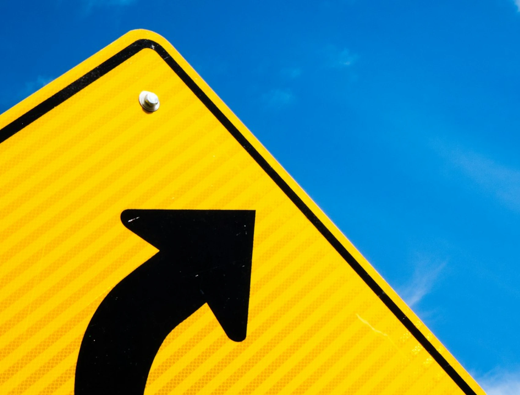 red and white arrow sign